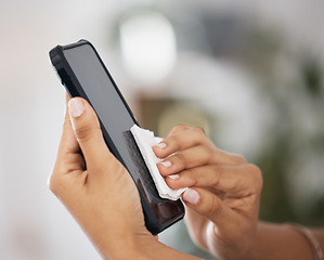 Image showing Tissue, screen and hands of a person with a phone for clean, safety and free from virus. Cleaning, covid and worker with a cloth to disinfect technology, mobile or smartphone for health at work