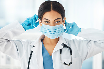 Image showing Healthcare, covid and doctor hands on face mask for compliance in a hospital, safety and hygiene. Portrait, corona and woman health worker ppe for work during global pandemic, crisis and lockdown