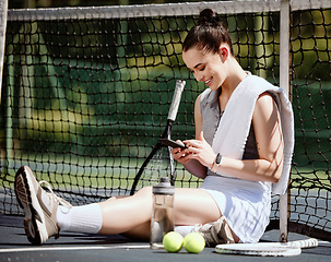 Image showing Relax, fit and phone with woman tennis player browsing, social media or web outdoor on the court. A happy young female athlete or sportswoman posting her sport training online or on the internet