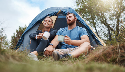 Image showing Camping, tent and nature couple with coffee, tea or hot chocolate relax in outdoor forest or woods. Grass field trees, morning view and camper people bond, talk or enjoy quality time peace or freedom