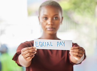 Image showing Equal pay, paper sign and black woman protest for women work salary rights outdoor. Portrait of a young person from Africa with serious protesting for female worker empowerment and equality