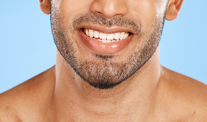 Image showing Teeth, mouth and beard of a man with a smile for dental, health and wellness against a blue studio background. Healthcare, lips and face of a happy and clean model with results from care for tooth