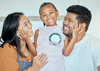 Image showing Family, parents with child, hug and apron for cooking or baking at family home, for learning and development with bonding in happy portrait. Young girl, mother and father together, love and care.