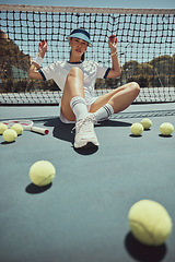 Image showing Relax, portrait and tennis woman at net on exercise, fitness and court break at sports ground. Training, workout and cardio of professional athlete club girl resting on floor with tennis balls.