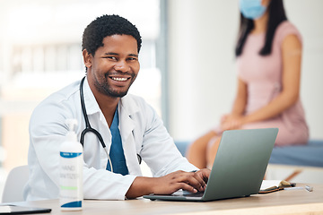 Image showing Doctor, laptop and smile for healthcare appointment, checkup or research for insurance or policy at the hospital. Happy medical GP man smiling for medicine, technology or patient data on computer