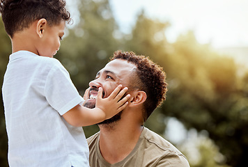 Image showing Dad, boy touch face in outdoor park or backyard for summer bonding, happiness together and sunshine. Father son, happy black man in nature for love smile and quality time with child