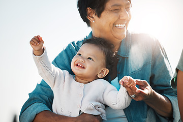 Image showing Happy grandma, baby and relax in nature on vacation, trip or family holiday. Love, care and grandmother bonding with child, infant or toddler outdoors, outside in sunshine and enjoying time together.