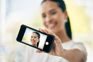 Image showing Phone, selfie and screen with a woman taking a photograph on her smartphone for social media. Face, portrait and headshot with a female posing for a picture using wireless mobile technology alone