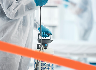 Image showing Cleaning, disinfection and person in hazmat suit in lab with sanitizer to clean germs, virus exposure and spray. Covid, hygiene and medical worker sanitizing hospital, medical lab and clinic in ppe