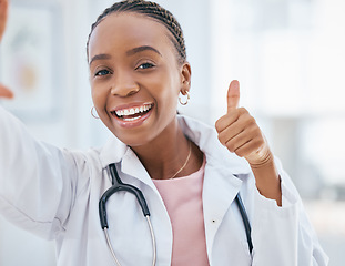Image showing Thumbs up, healthcare and medical with a black woman doctor working in the hospital for medicine or care. Thank you, hand sign and motivation with a female clinic professional saying yes with a smile