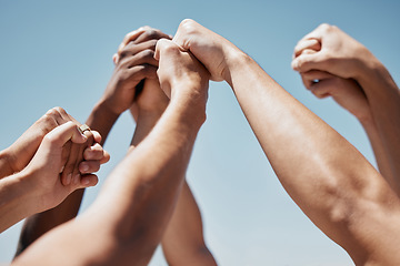 Image showing Pray, hands and community praying against a blue sky background for worship, praise and religion outside. Prayer, church and hand of people united in support of love, peace and God by spiritual group