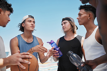 Image showing Basketball, team and collaboration for game strategy, planning or sports discussion in the outdoors. Group of athletic sport players in social conversation for teamwork, cooperation and match plan