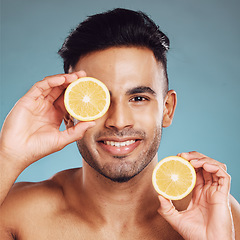 Image showing Skincare in nature, beauty and man with lemon for vitamin c facial detox for healthcare, natural and healthy skin glow. Fruit, wellness and sustainability, luxury eco cleaning and grooming product.