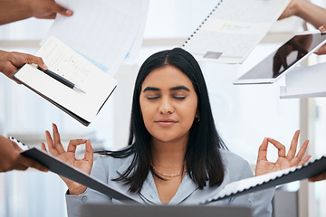 Image showing Busy, stress and woman meditate in the office, hands holding paperwork, documents and tablet around her. Stress free, workload and calm Indian woman in workplace for peace, zen and relaxed lifestyle
