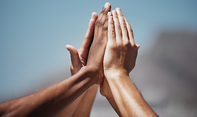 Image showing Team sports, diversity and hands doing high five in air for motivation, community and support. Teamwork, inspiration and multicultural group ready to start training, exercise and play in outdoor park