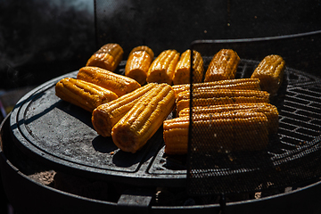 Image showing A professional cook prepares corn