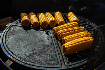 Image showing A professional cook prepares corn