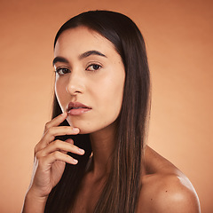 Image showing Beauty, woman and portrait in studio for skincare, wellness and grooming against orange background mockup. Face, hair and girl model proud, confident and fresh after hygiene, treatment and cosmetics