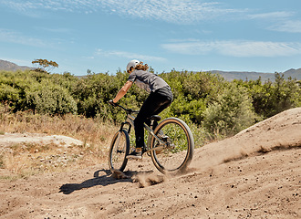 Image showing Bicycle, nature and athlete on a dirt trail for an outdoor adventure, journey or training. Bike, sports and man cycling on off road in a field for exercise, workout or action racing in South Africa.