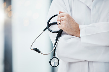 Image showing Senior doctor, hands and stethoscope in hospital ready for diagnosis, check up or heart health closeup. Healthcare, expert or cardiologist holding equipment for cardiology exam in doctors office.