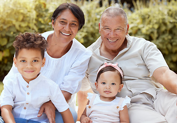 Image showing Family, children and grandparents with a girl and boy spending time together in the garden during a visit. Nature, relax and love with a senior man and woman bonding with their grandkids outdoor