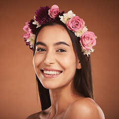 Image showing Woman, beauty smile and flower headband for spring portrait. Young happy girl, natural cosmetic makeup and healthy facial skincare wellness glow with floral rose band in orange background studio