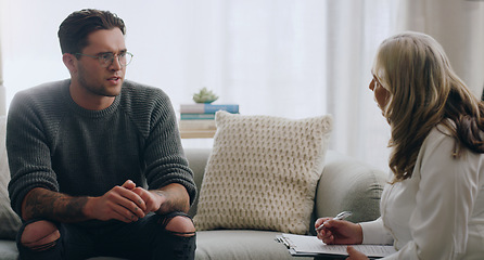 Image showing Therapy, man and therapist talking about mental health during a consultation in an office. Depression, communication and psychologist consulting with sad patient about anxiety or problem of the mind