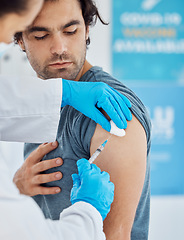 Image showing Covid, vaccine and injection with a man patient getting his booster shot in a hospital with a doctor in gloves. Medicine, health and insurance with a male in a clinic to boost his immune system