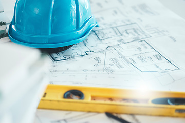 Image showing Architecture, blueprint and plan, construction and helmet, engineering design and drawing with level closeup. Construction site, building industry and renovation paperwork, planning and 2d sketch.