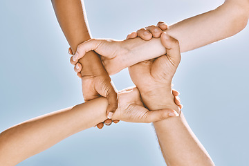 Image showing Wrist hands, teamwork and diversity, support or community, trust or cooperation on blue sky. Collaboration, business people holding arms or motivation for goal, mission or target, unity or solidarity