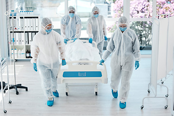 Image showing Covid, ppe and doctors with patient stretcher in hospital for quarantine or testing. Health, safety and medical workers in hazmat suits pushing bed in clinic after death of person with covid 19.