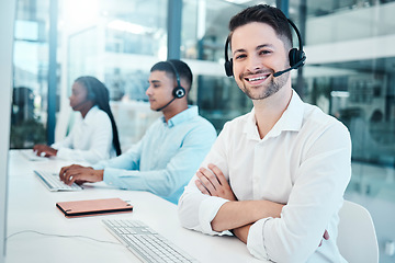 Image showing Customer service, call center and support with a man consulting using a headset in a sales office. Ecommerce, contact us and telemarketing with a male consultation working as a professional crm agent