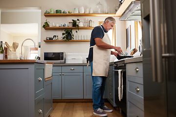 Image showing Senior man, cooking food and stove kitchen, lunch meal and dinner in frying pan in New Zealand home. Mature house chef with apron make easy recipe, cuisine and fresh diet for dining in retirement