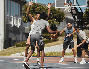 Image showing Basketball, training and team sports by basketball players in competitive match, fitness and energy at basketball court. Workout, friends and exercise by men group playing, competing and performance