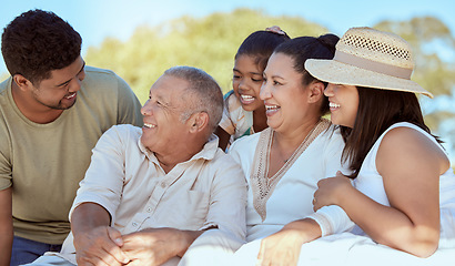 Image showing Kid, parents and grandparents picnic in park, happy family have fun and spending time together in New Zealand. Nature, love and family, men and women with girl child, generations on summer weekend.