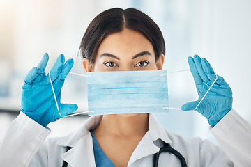 Image showing Covid face mask, woman doctor and safety ppe for healthcare, wellness consulting and professional surgeon working in hospital. Portrait of medical worker prepare for corona virus surgery in clinic