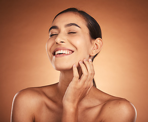 Image showing Woman, beauty and smile for skincare, cosmetics or makeup of model in happiness against a studio background. Happy female smiling for moisturizer, facial or care in soft perfect skin treatment