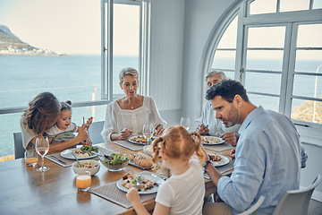 Image showing Family, generations and food, eating together in family home by the beach, healthy meal, nutrition and bonding. Big family, parents with grandparents and children eat at house by coast of Australia.