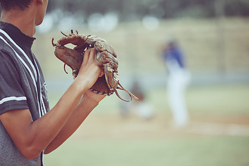 Image showing Baseball, sports and a pitcher throwing a ball during a competitive game or match on a grass pitch field. Fitness, exercise and sport with a man baseball player playing in a competitive outdoor event