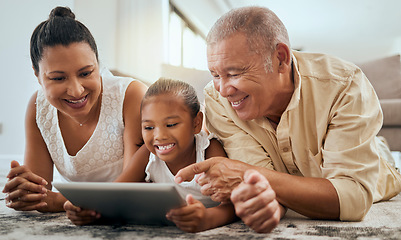 Image showing Grandparents, child or digital tablet in house or family home living room floor on movie streaming, internet game or education learning. Happy smile, bonding girl or senior man or woman on technology