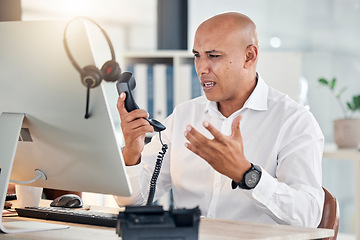 Image showing Call center, customer service and arguing with a frustrated man at work in a telemarketing office. Contact us, consulting and angry with an annoyed male working as a sales, support or crm agent