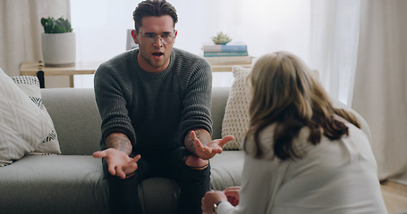 Image showing Stress, anxiety and man talking to psychologist on sofa in mental health, anxiety or bipolar counselling therapy. Angry, explaining or crisis patient in psychology counseling communication with woman