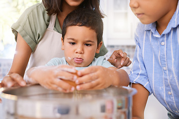 Image showing Family, cooking and child learning about baking with eggs in home kitchen with mom teaching kid to bake. Boy, woman and sibling together while helping to cook a meal, cake or food for quality time