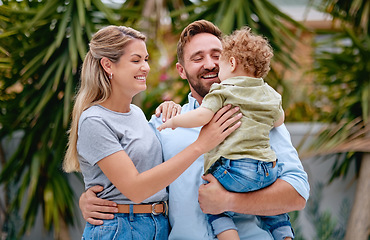 Image showing Family, love and parents with child in garden with smile, happy and hug together in summer. Excited, relax and loving mother and father on outdoor holiday with a kid in a park, nature or backyard