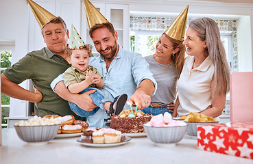 Image showing Birthday cake for boy child, home with family and celebrate with food in Texas kitchen. Happy baby smiles in dads arms, candles on dessert and grandparents at first celebration with gifts on table