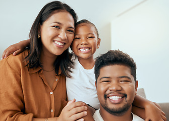 Image showing Happy family, mother and father with child in a portrait enjoying quality time with big smiles on their faces. Young kid, mama and dad love relaxing together on a living room sofa in a house in Peru