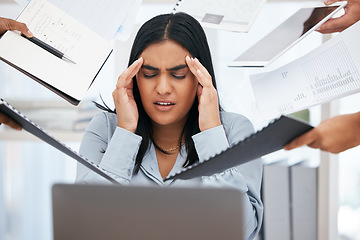 Image showing Stress, overworked and multitask with a business woman feeling overwhelmed by the hands of her team in the office. Compliance, documents and headache with a female employee suffering from burnout