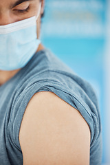 Image showing Man, shoulder and waiting for covid vaccine, injection or syringe for appointment at the clinic. Male getting ready for vaccination to combat the virus, disease or illness for checkup at the hospital