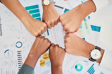 Image showing Finance, accounting and team fist bump from above over documents for investing. Teamwork, goal and success of financial experts with hands joined for motivation for partnership, community and report