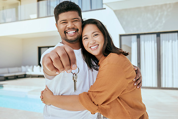 Image showing Homeowner, couple and show keys to new house, being happy and successful with smile, relax and hug. Portrait, black man and Asian woman celebrate, on property investment and embrace together outdoor.